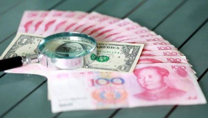 人民币兑美元汇率跌破7.1